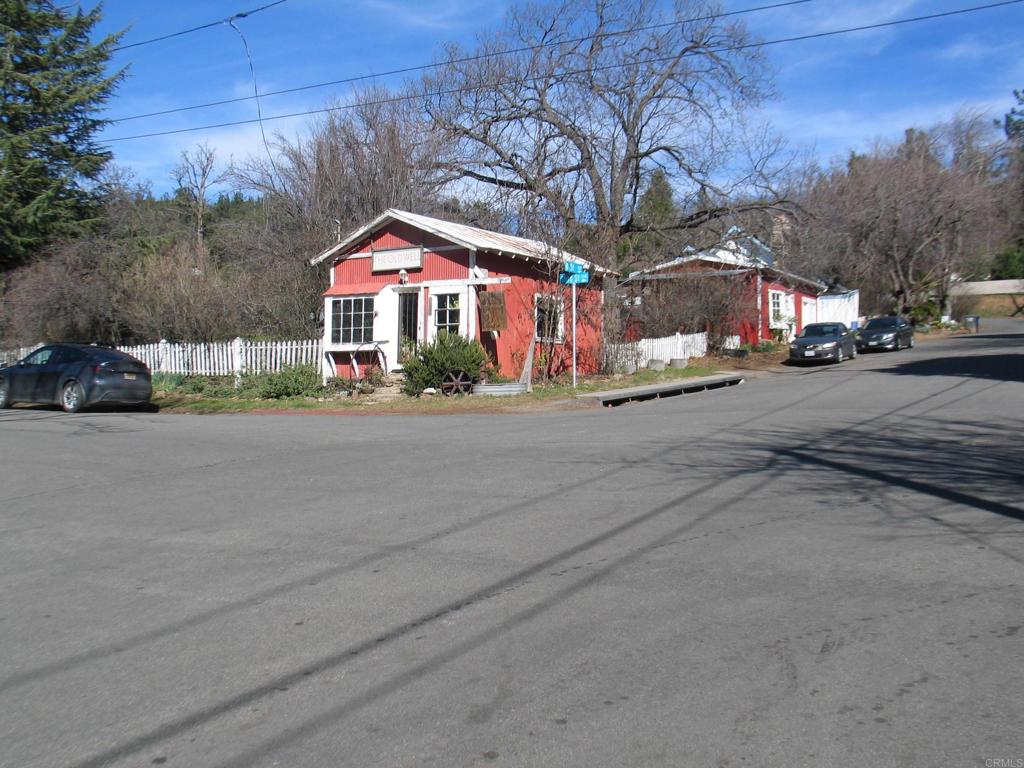 a street view with a car parked on the side of road