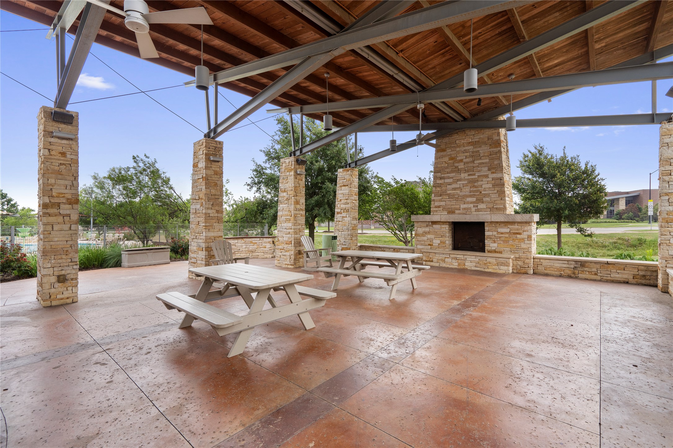 1128 Clearwing Circle Georgetown, TX 78626 - Photo 36 of 38 Large covered patio picnic area with fireplace is perfect for hosting a gathering or having an outdoor meal.