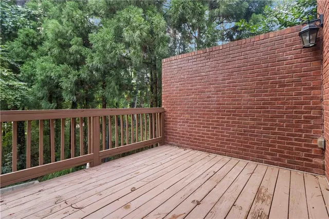 a view of wooden balcony with wooden floor