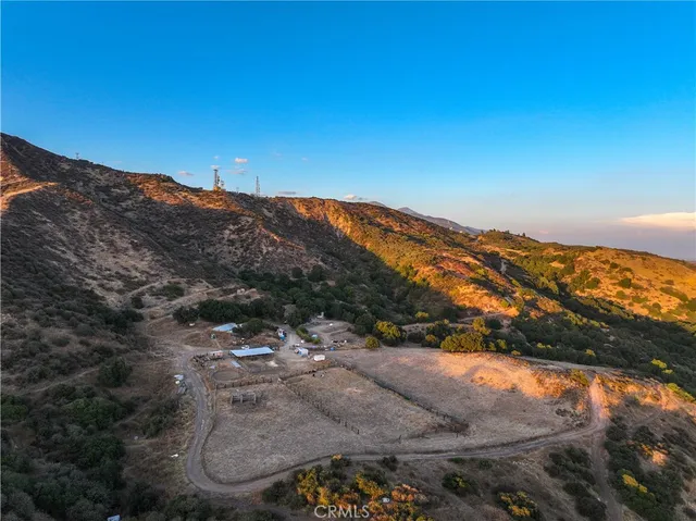 a view of a dry yard with mountain