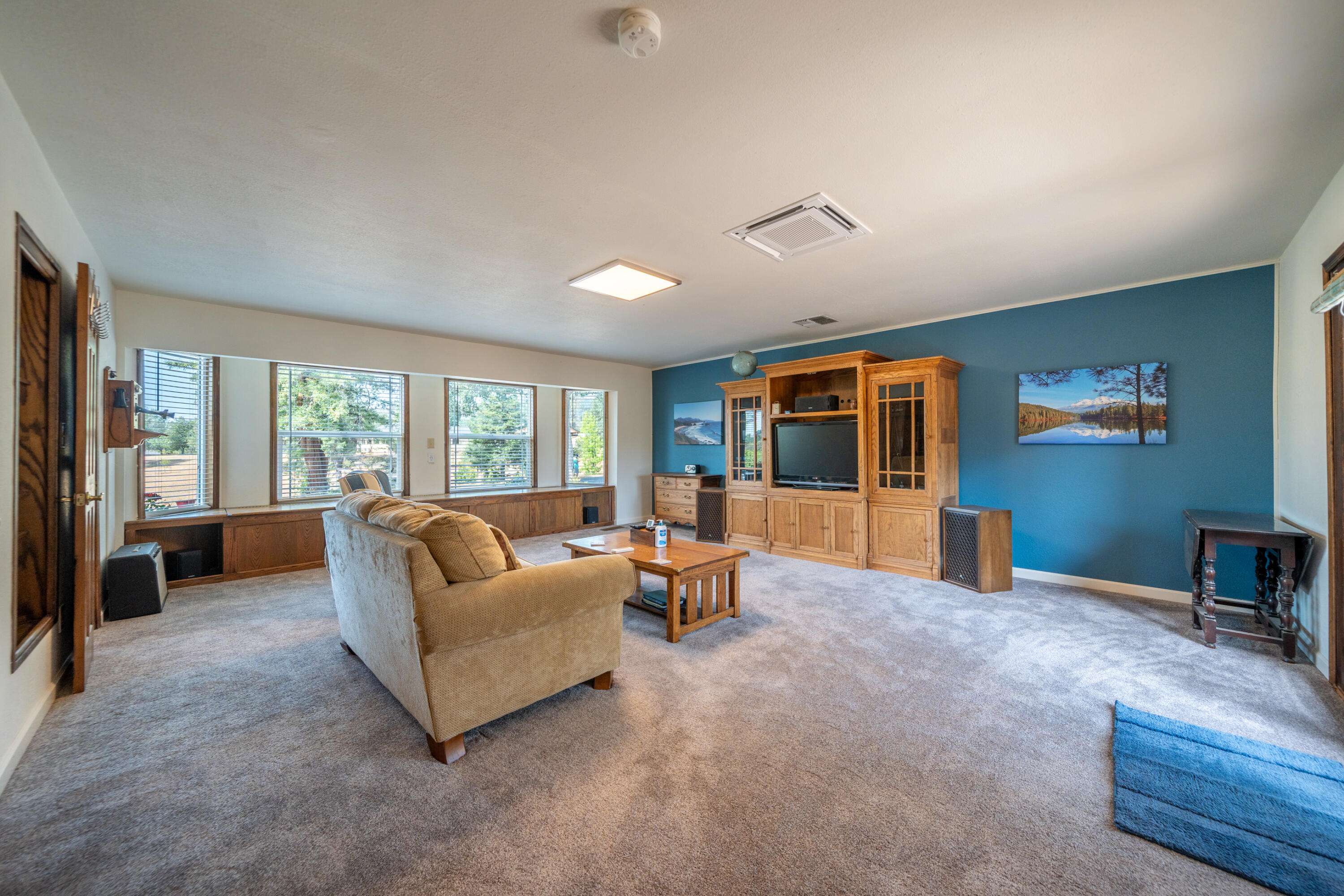 15842 Macleod Drive Redding, CA 96001 - Photo 12 of 36 a living room with furniture and large windows