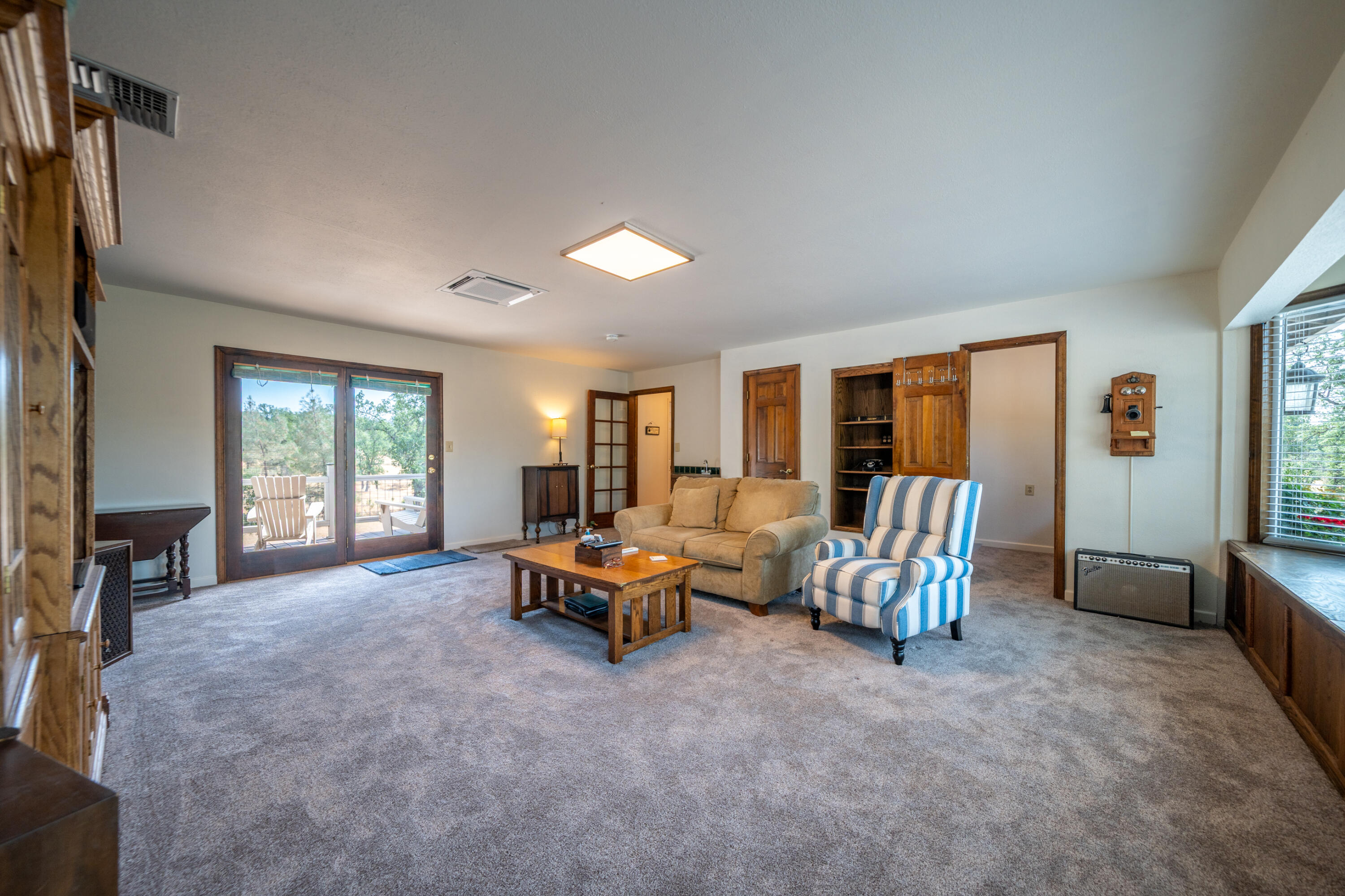 15842 Macleod Drive Redding, CA 96001 - Photo 13 of 36 a living room with furniture and large windows
