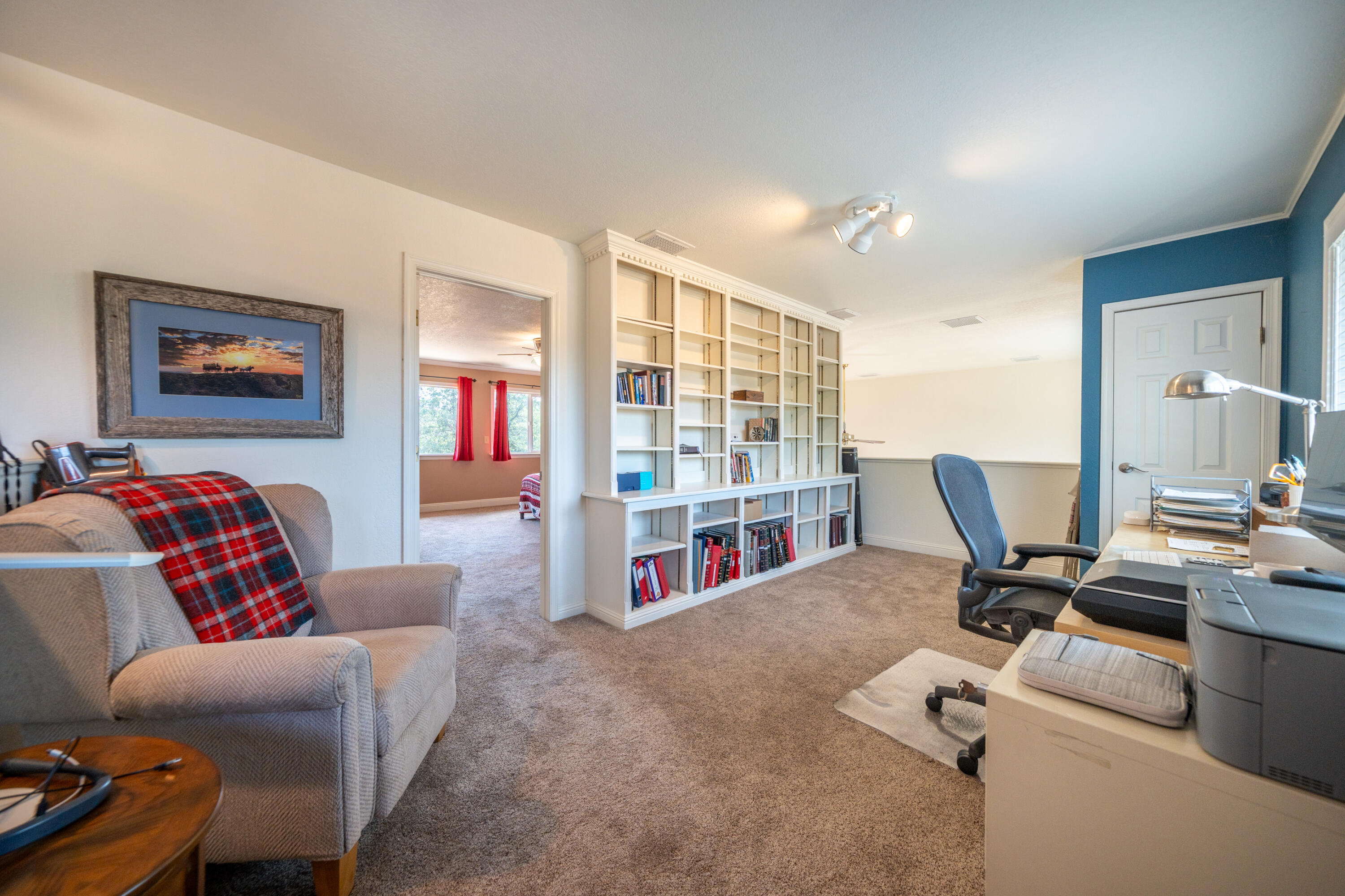 15842 Macleod Drive Redding, CA 96001 - Photo 17 of 36 a living room with furniture a flat screen tv and a table
