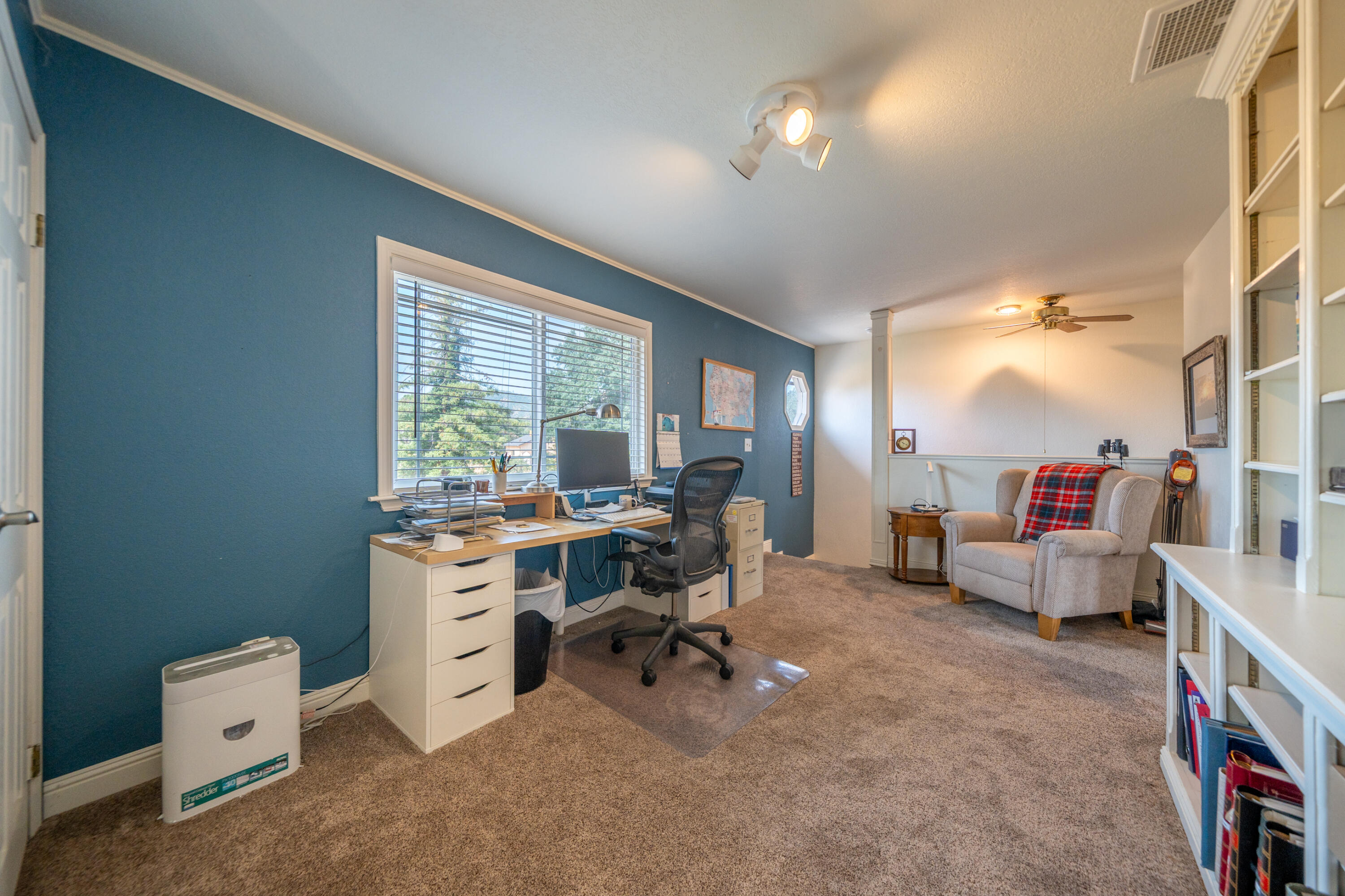 15842 Macleod Drive Redding, CA 96001 - Photo 18 of 36 a view of a livingroom with workspace and a window