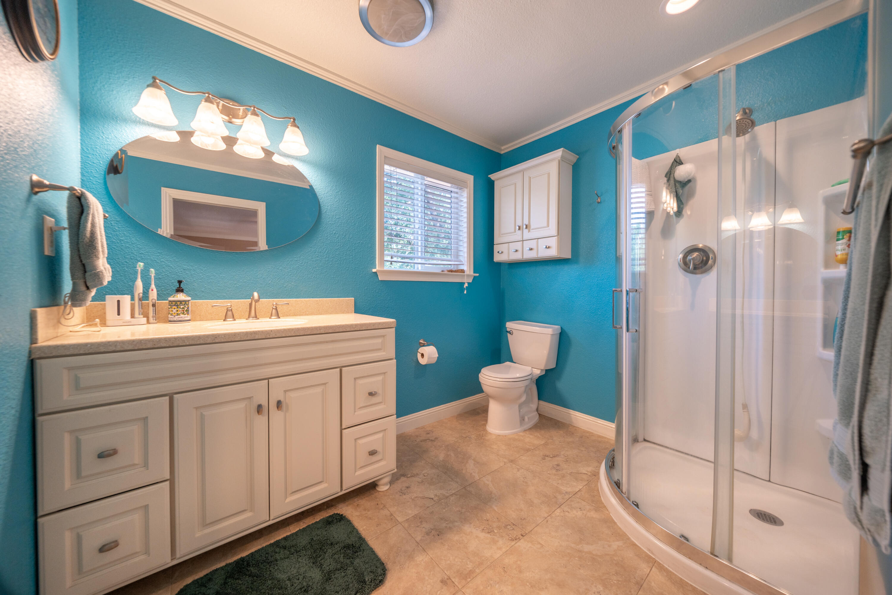 15842 Macleod Drive Redding, CA 96001 - Photo 20 of 36 a bathroom with a double vanity sink mirror and toilet