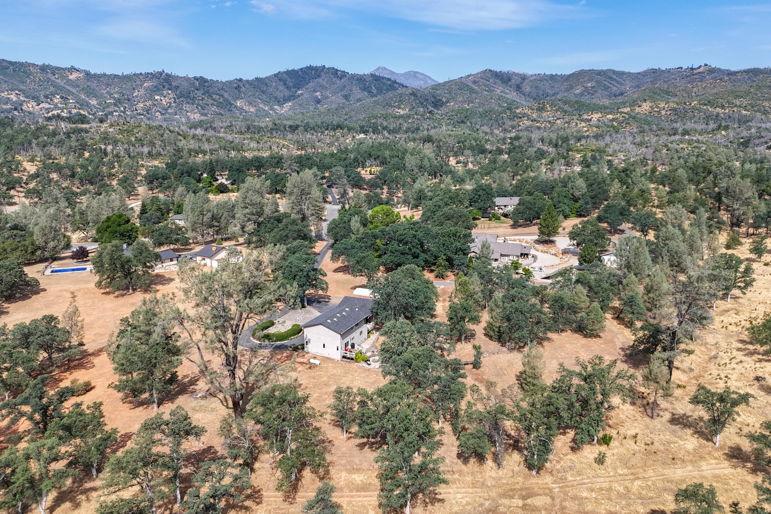 15842 Macleod Drive Redding, CA 96001 - Photo 31 of 36 an aerial view of houses covered in trees