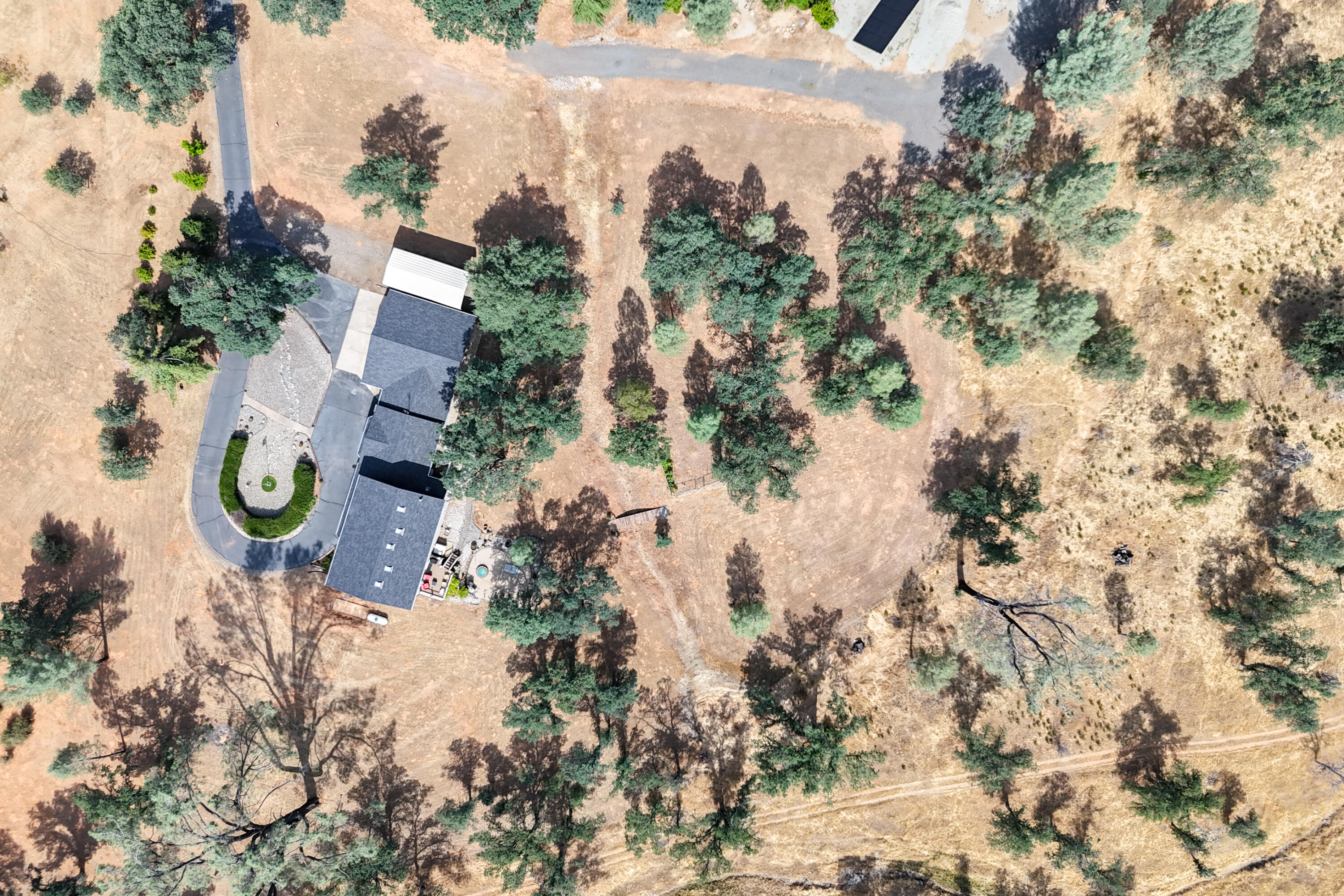 15842 Macleod Drive Redding, CA 96001 - Photo 36 of 36 an aerial view of house with yard swimming pool and trees