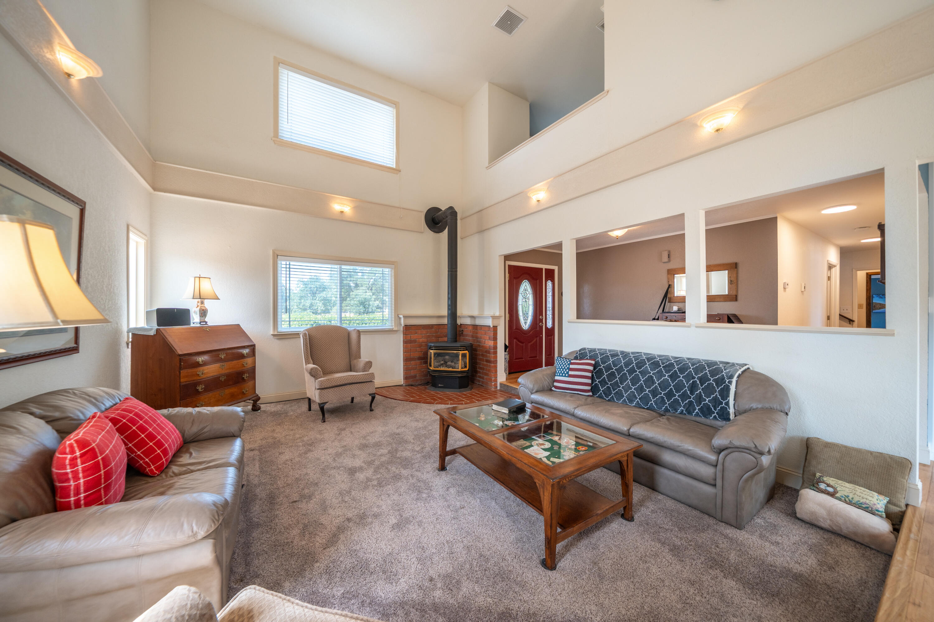 15842 Macleod Drive Redding, CA 96001 - Photo 6 of 36 a living room with furniture kitchen view and a window