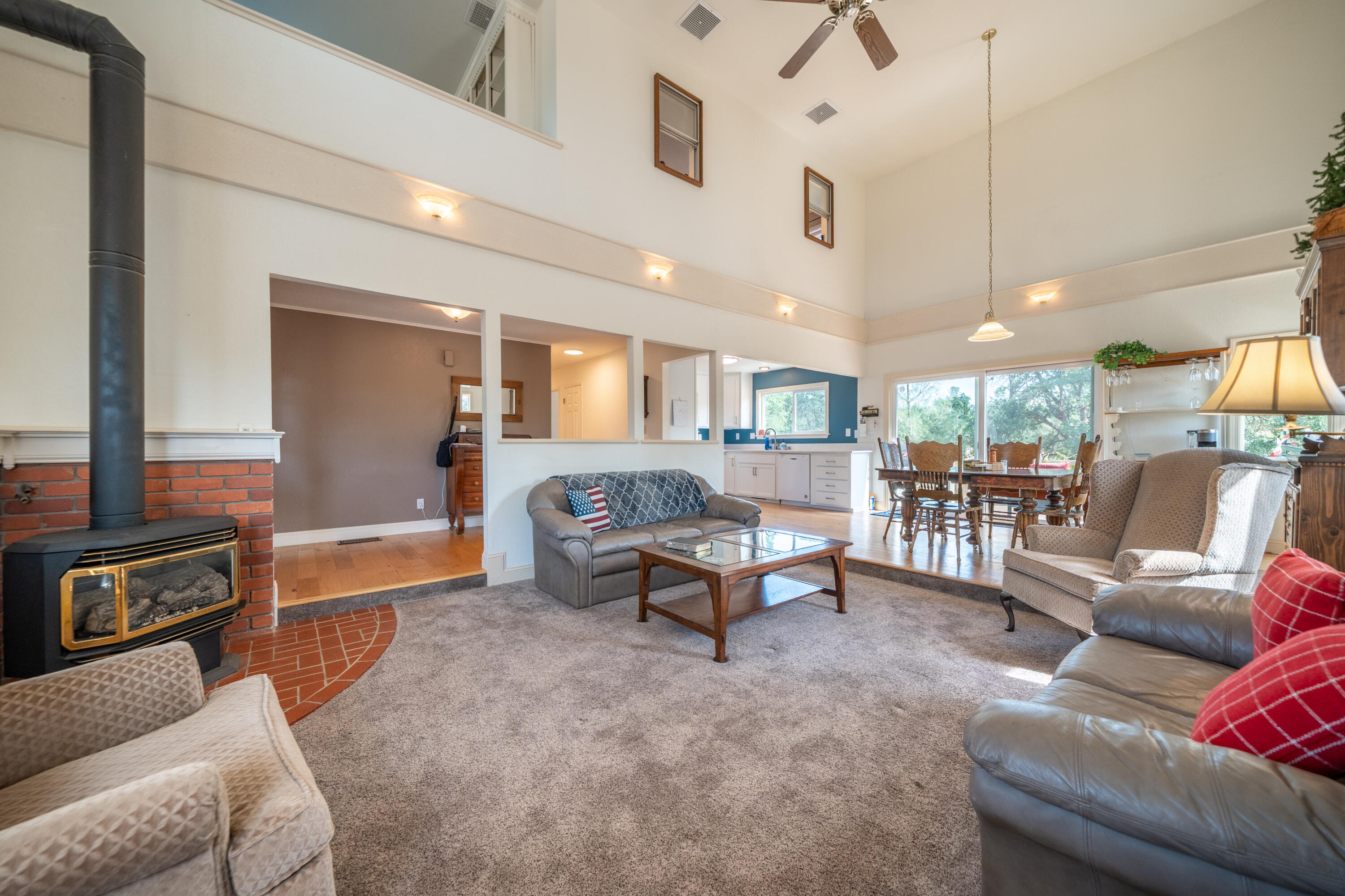 15842 Macleod Drive Redding, CA 96001 - Photo 7 of 36 a living room with furniture and a flat screen tv