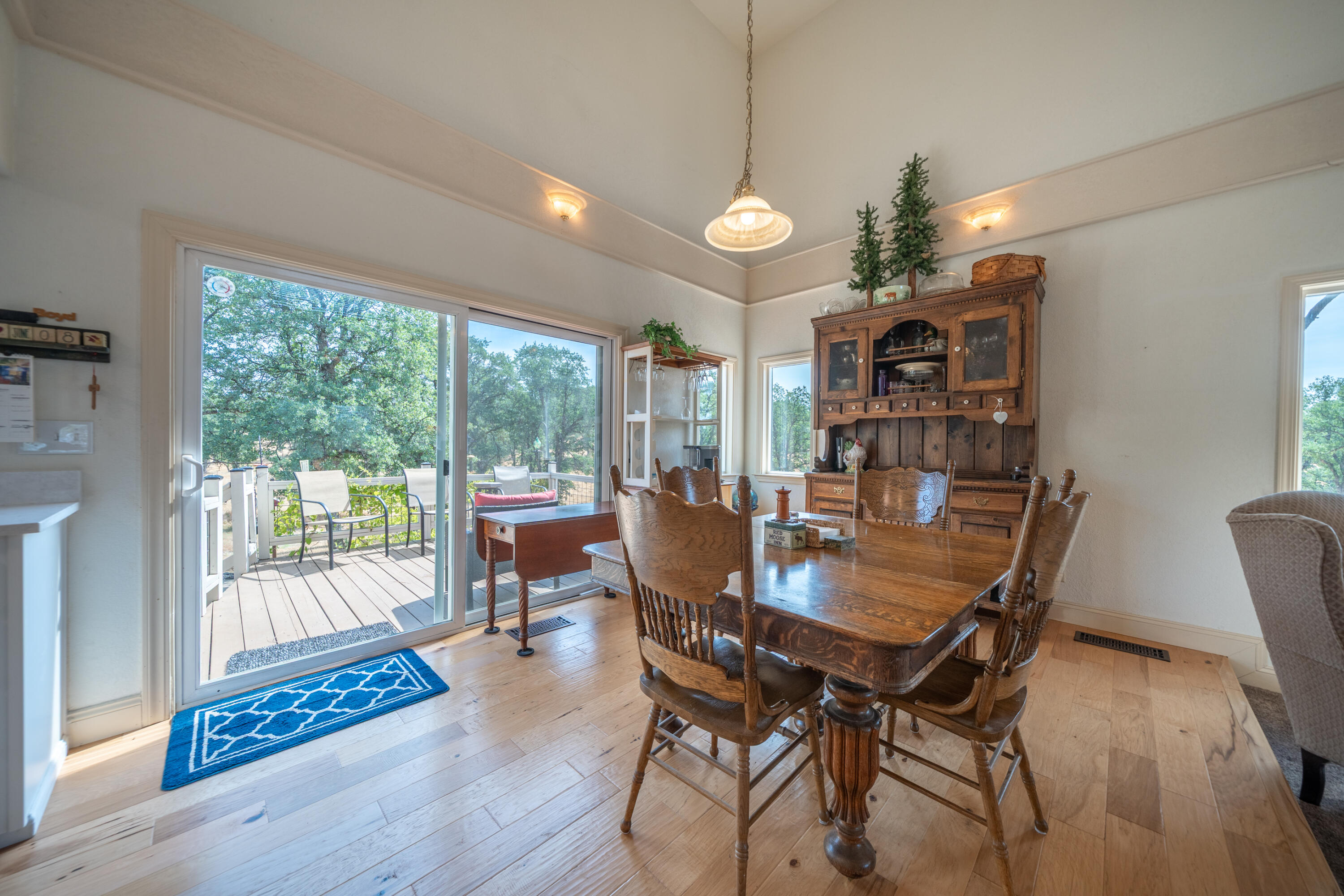 15842 Macleod Drive Redding, CA 96001 - Photo 8 of 36 a view of a dining room with furniture window and wooden floor