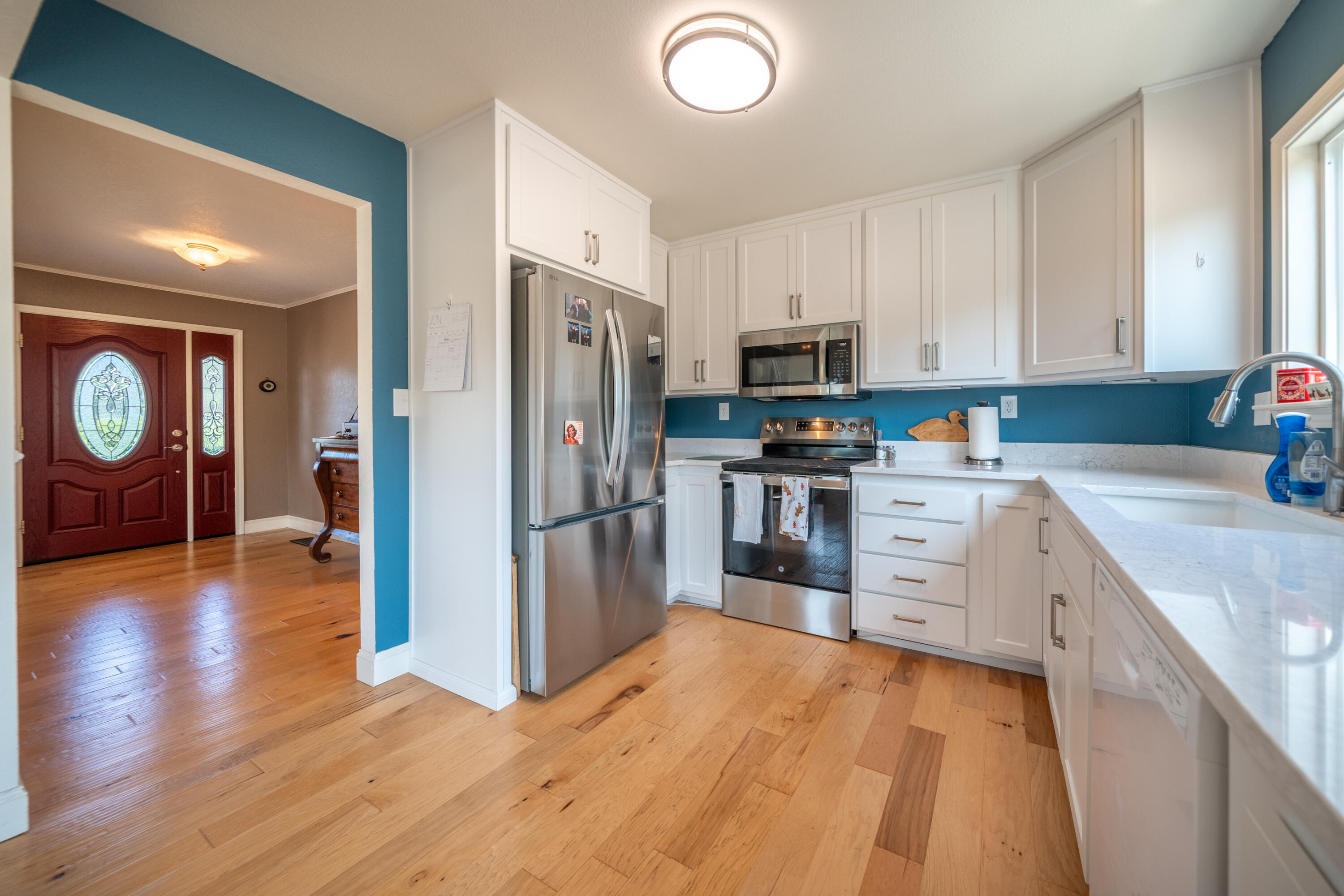 15842 Macleod Drive Redding, CA 96001 - Photo 10 of 36 a kitchen with stainless steel appliances a refrigerator sink and cabinets
