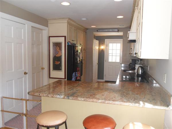 9 Wallace Road Wayland, MA 01778 - Photo 8 of 11 a bathroom with a granite countertop sink and a mirror