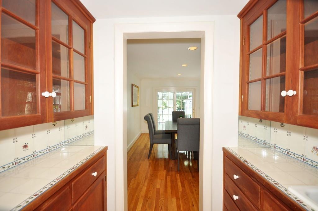 20 Dawes Road Lexington, MA 02421 - Photo 7 of 26 a en suite bathroom with a granite countertop sink and a large mirror