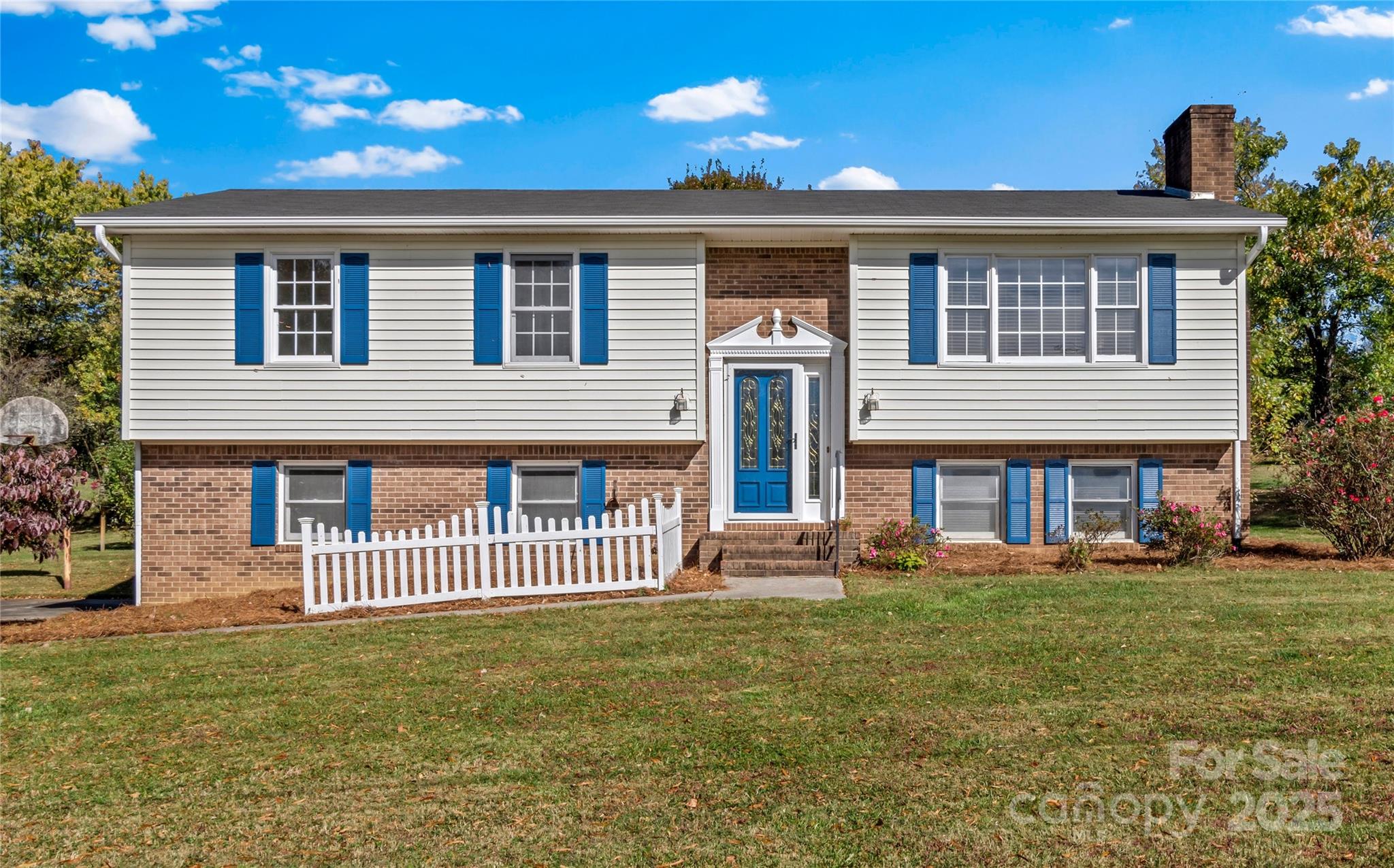1180 Faulkenberry Road King, NC 27021 - Photo 1 of 40 a front view of a house with a garden