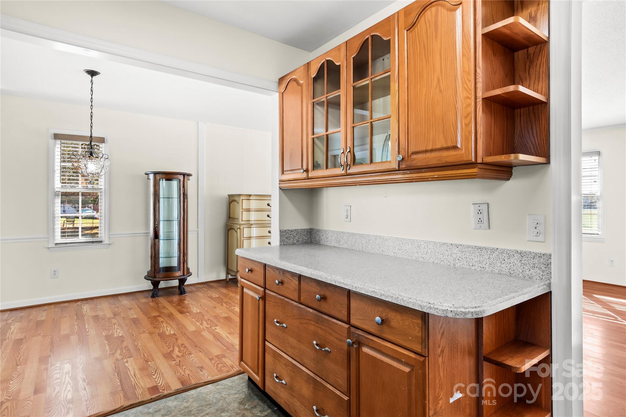 1180 Faulkenberry Road King, NC 27021 - Photo 17 of 40 a kitchen with a refrigerator and windows