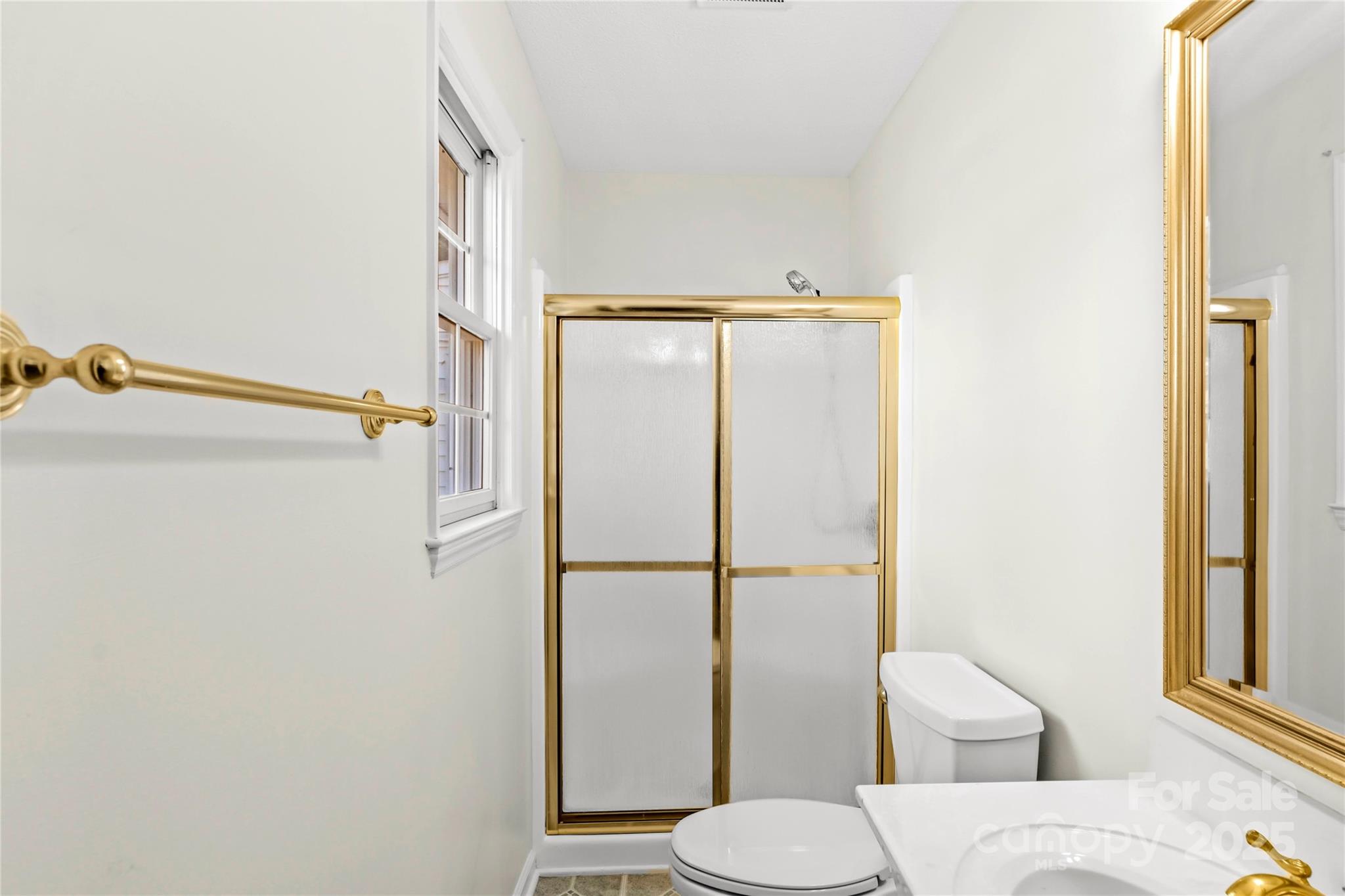 1180 Faulkenberry Road King, NC 27021 - Photo 20 of 40 a white toilet sitting next to a bathroom sink