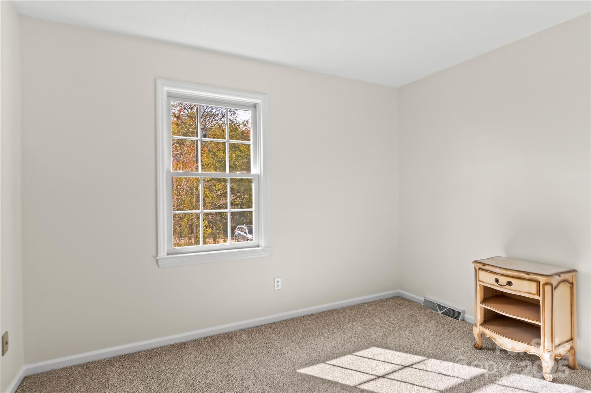 1180 Faulkenberry Road King, NC 27021 - Photo 22 of 40 an empty room with windows
