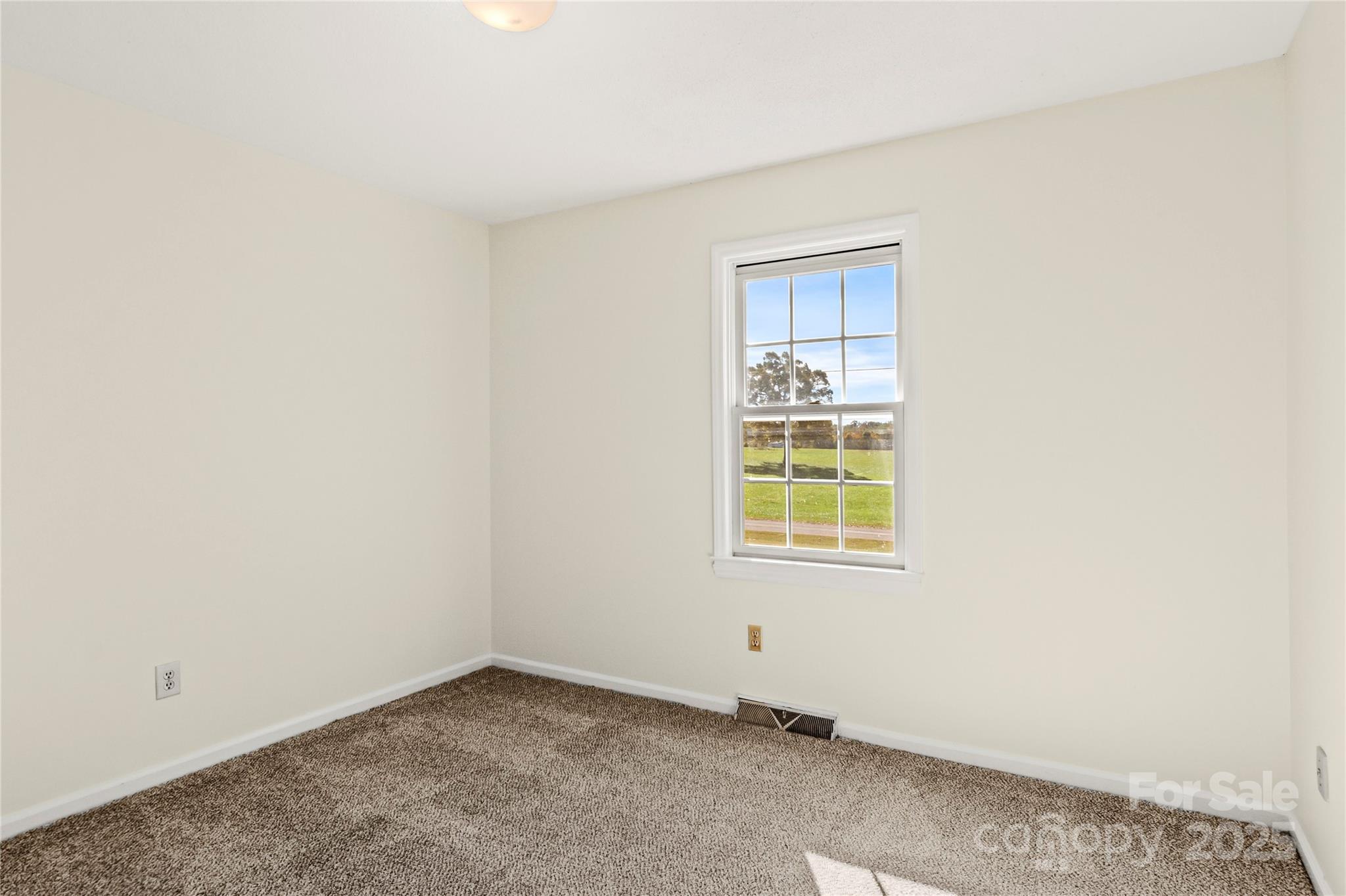 1180 Faulkenberry Road King, NC 27021 - Photo 24 of 40 an empty room with a window