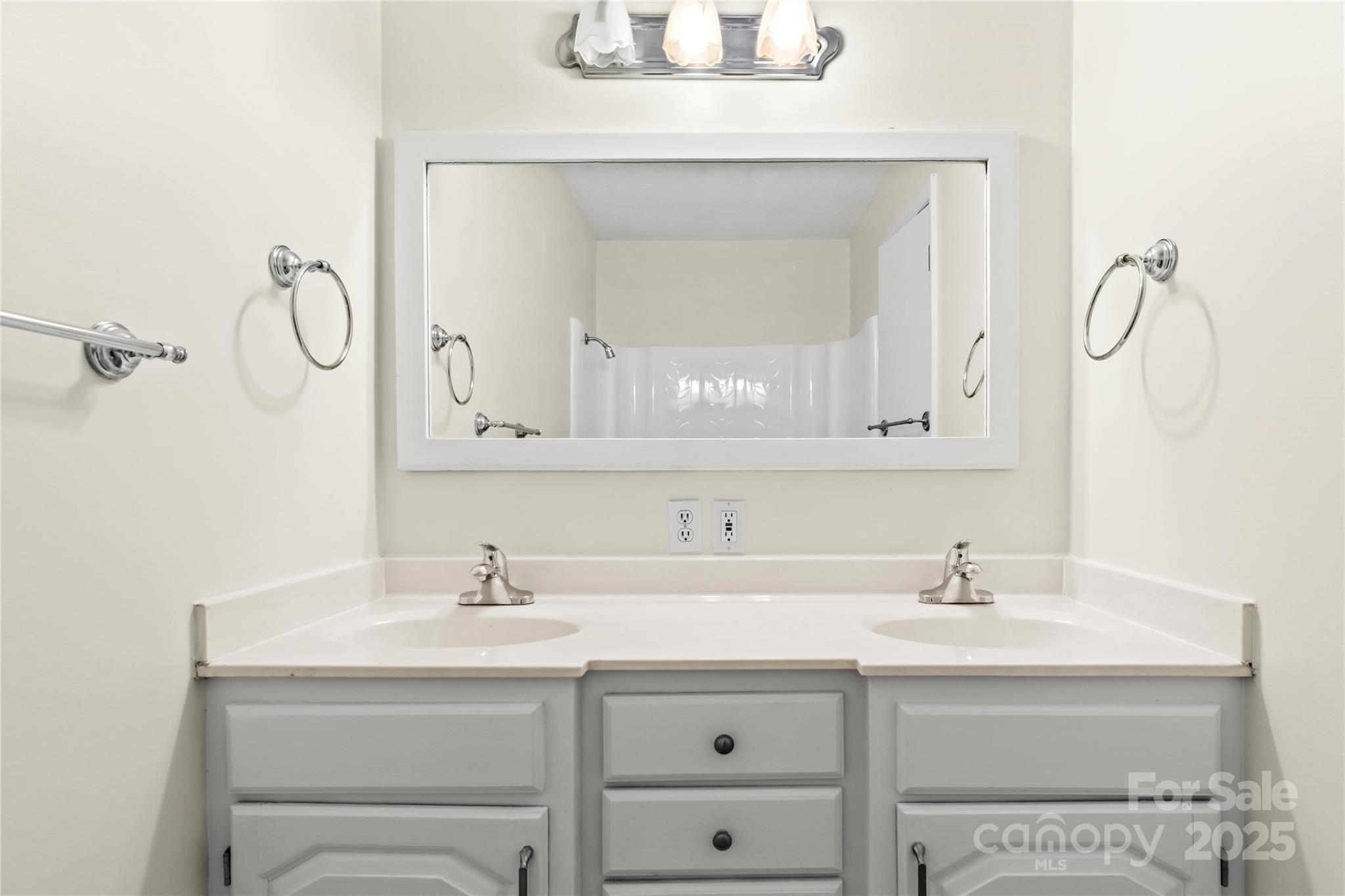 1180 Faulkenberry Road King, NC 27021 - Photo 26 of 40 a bathroom with a sink vanity and a mirror