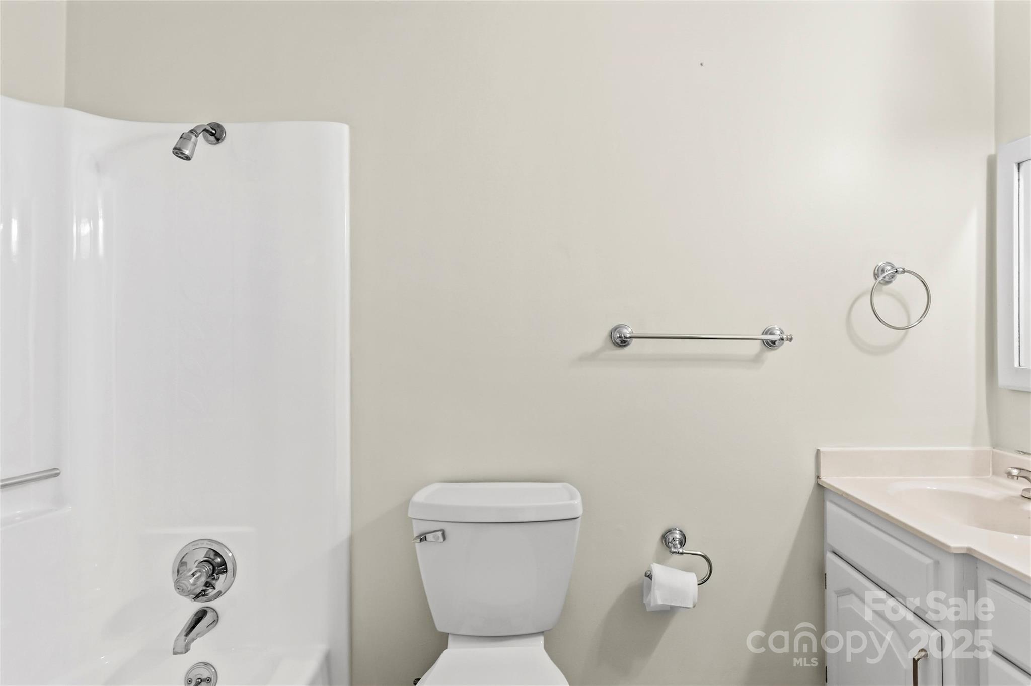 1180 Faulkenberry Road King, NC 27021 - Photo 27 of 40 a white toilet sitting next to a bathroom sink