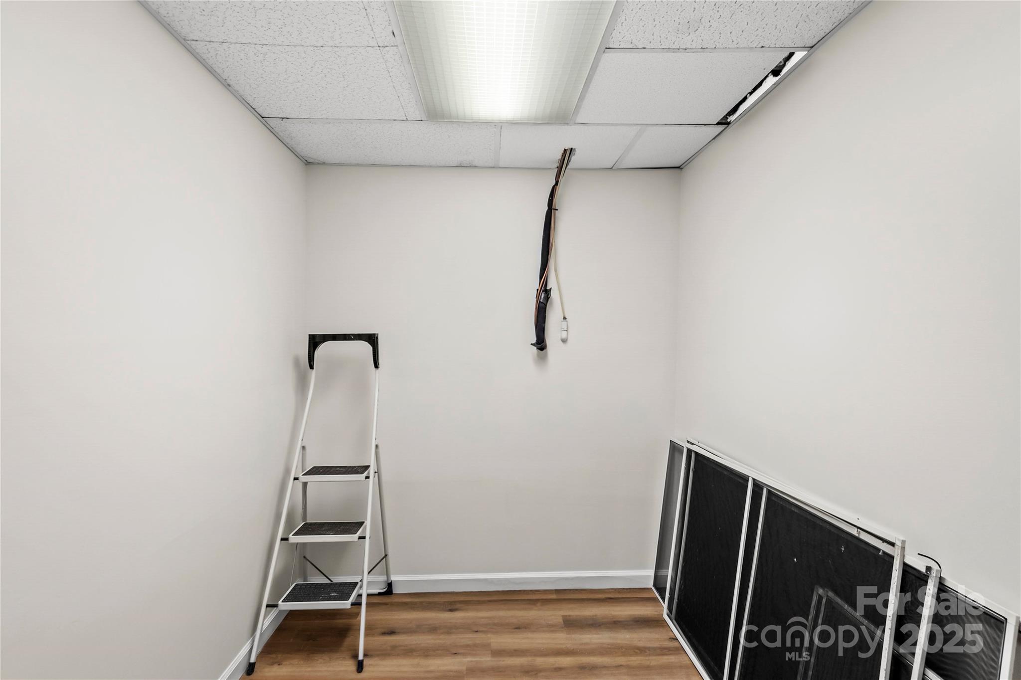 1180 Faulkenberry Road King, NC 27021 - Photo 35 of 40 a view of walk in closet with empty racks