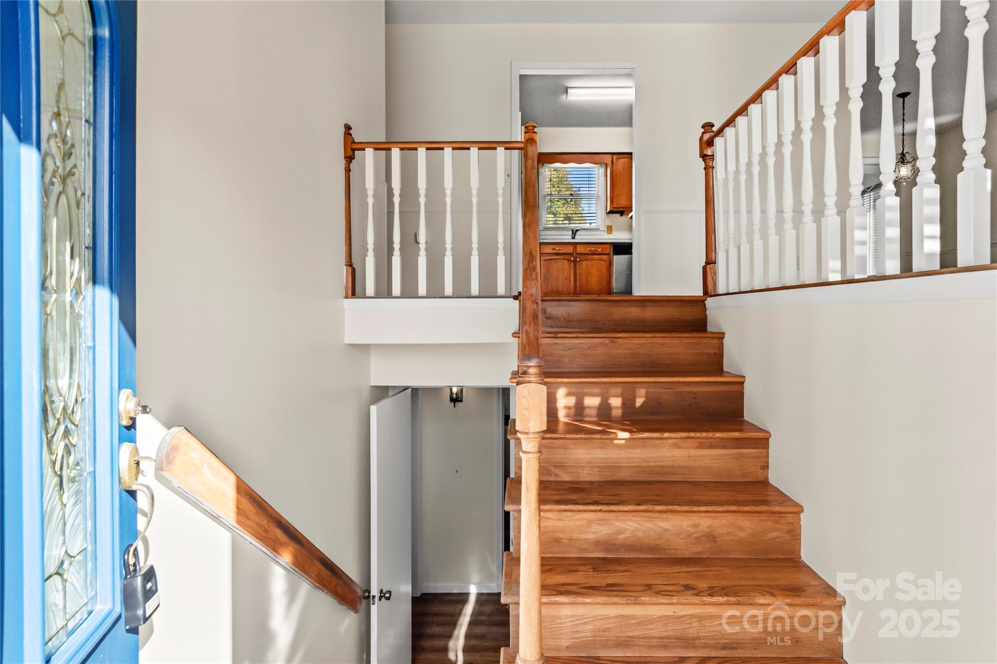 1180 Faulkenberry Road King, NC 27021 - Photo 7 of 40 a view of staircase with lots of frames on wall and a window