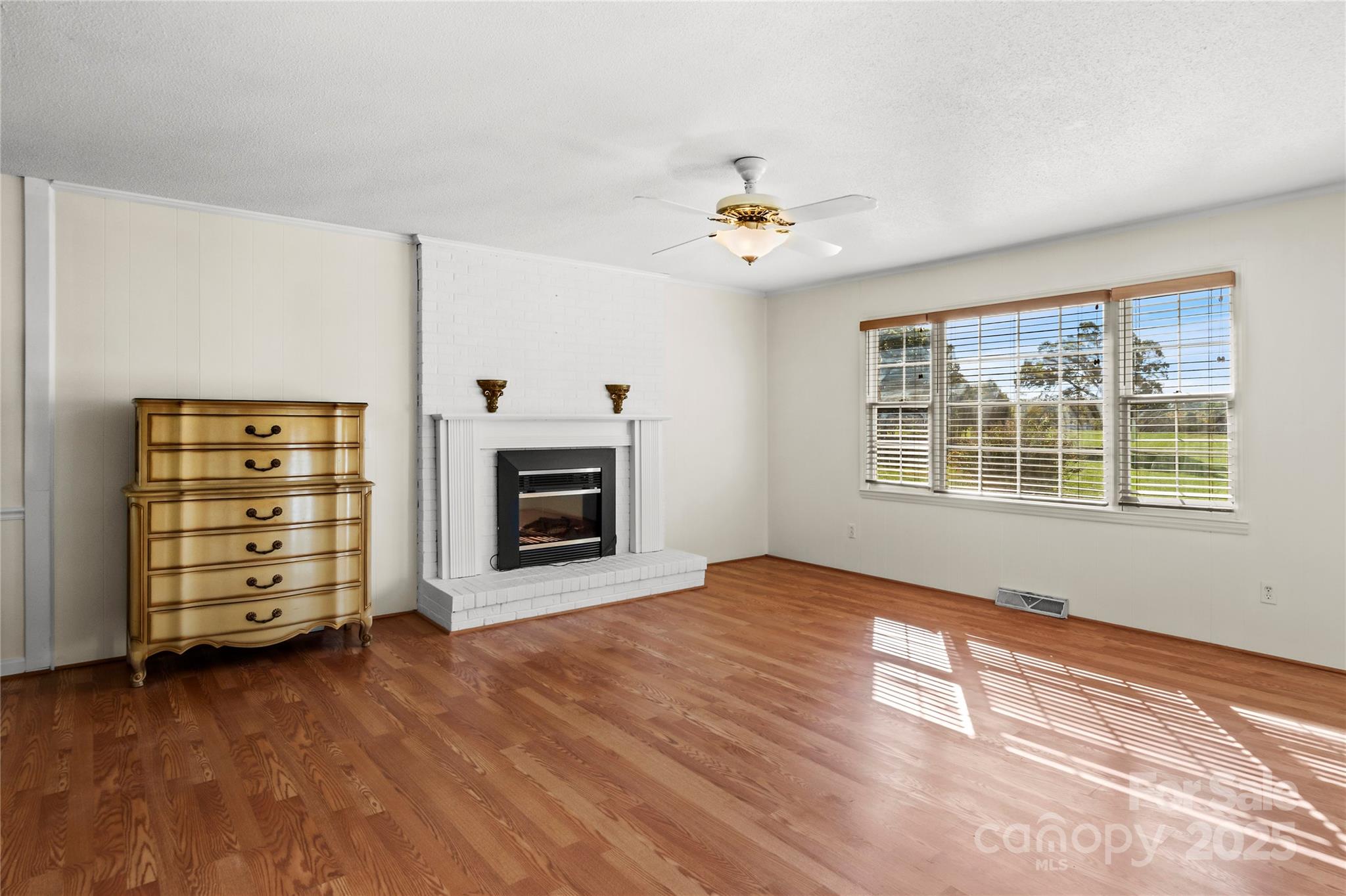 1180 Faulkenberry Road King, NC 27021 - Photo 9 of 40 an empty room with windows and fireplace