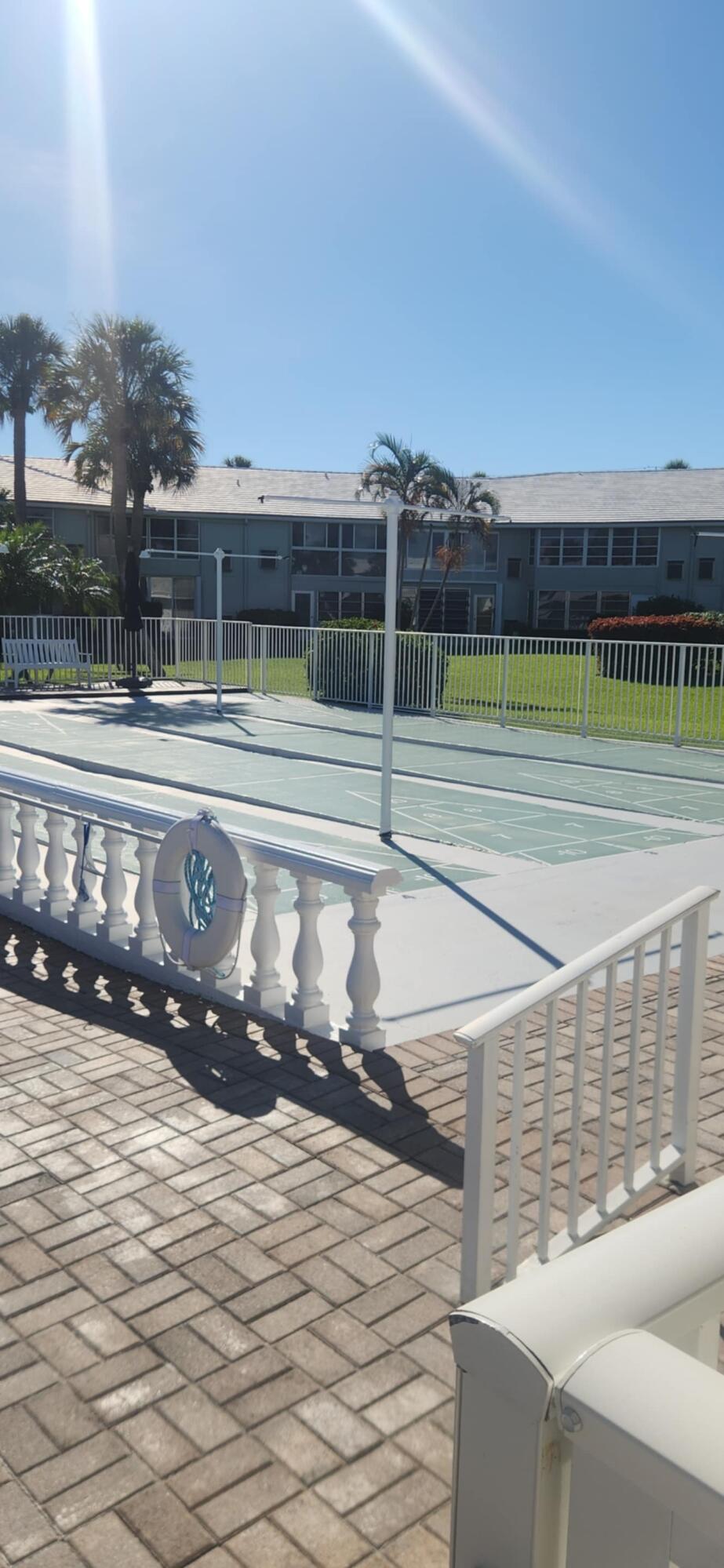 5550 North Ocean Boulevard, Unit 106 Ocean Ridge, FL 33435 - Photo 12 of 15 a view of a tennis court