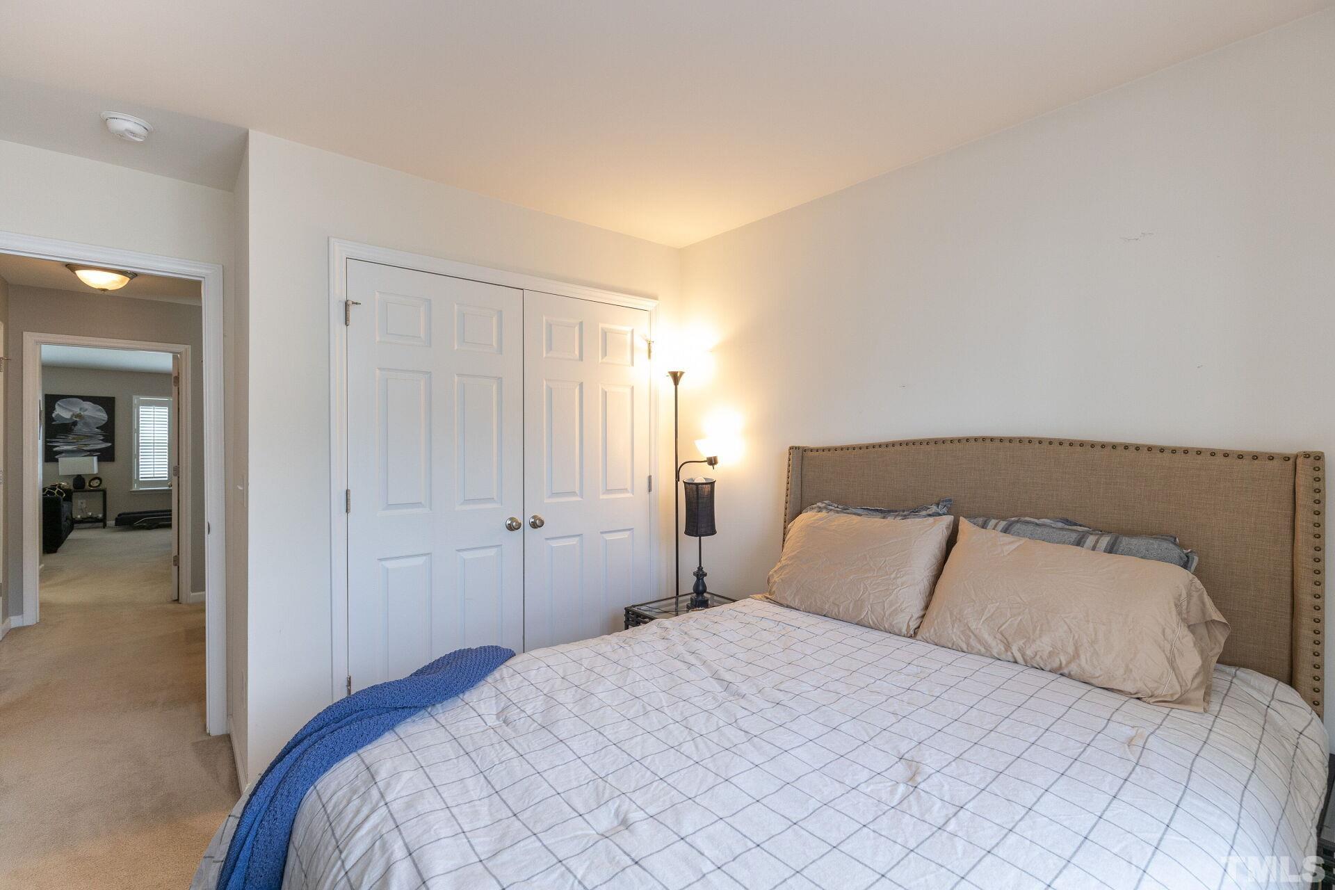 5110 Sandy Banks Road Raleigh, NC 27616 - Photo 26 of 31 a bedroom with a bed and closet