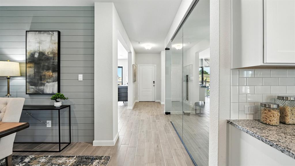 1233 Tree House Lane Decatur, TX 76234 - Photo 28 of 33 a bathroom with a granite countertop shower a sink and a mirror