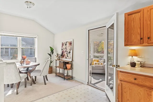 a view of a livingroom with furniture and a window