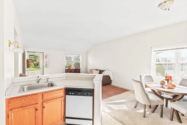 a kitchen with a stove a sink and a refrigerator