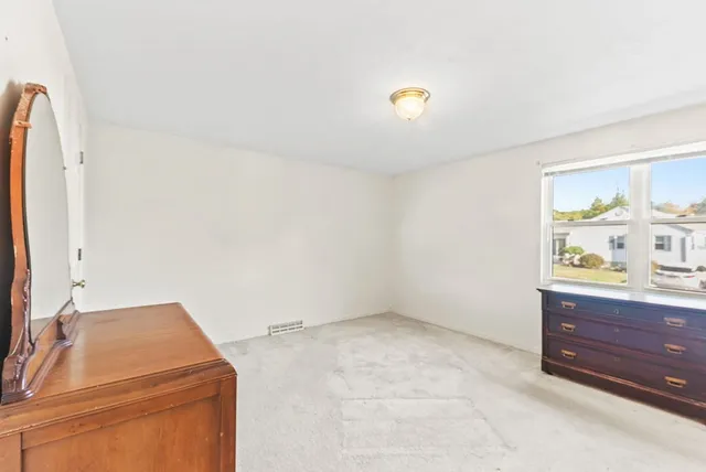 a room with cabinets and window