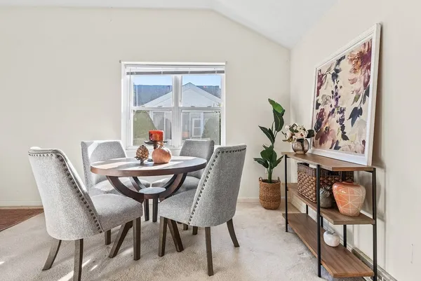 a view of a dining room with furniture window and outside view