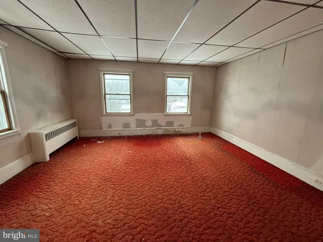 a view of a room with a hallway
