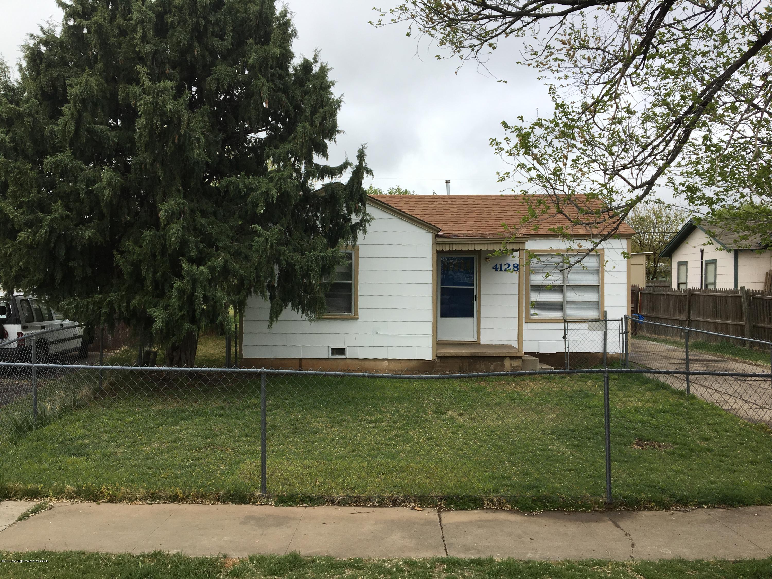 4128 South Polk Street Amarillo, TX 79110 - Photo 1 of 10 a front view of a house with a garden
