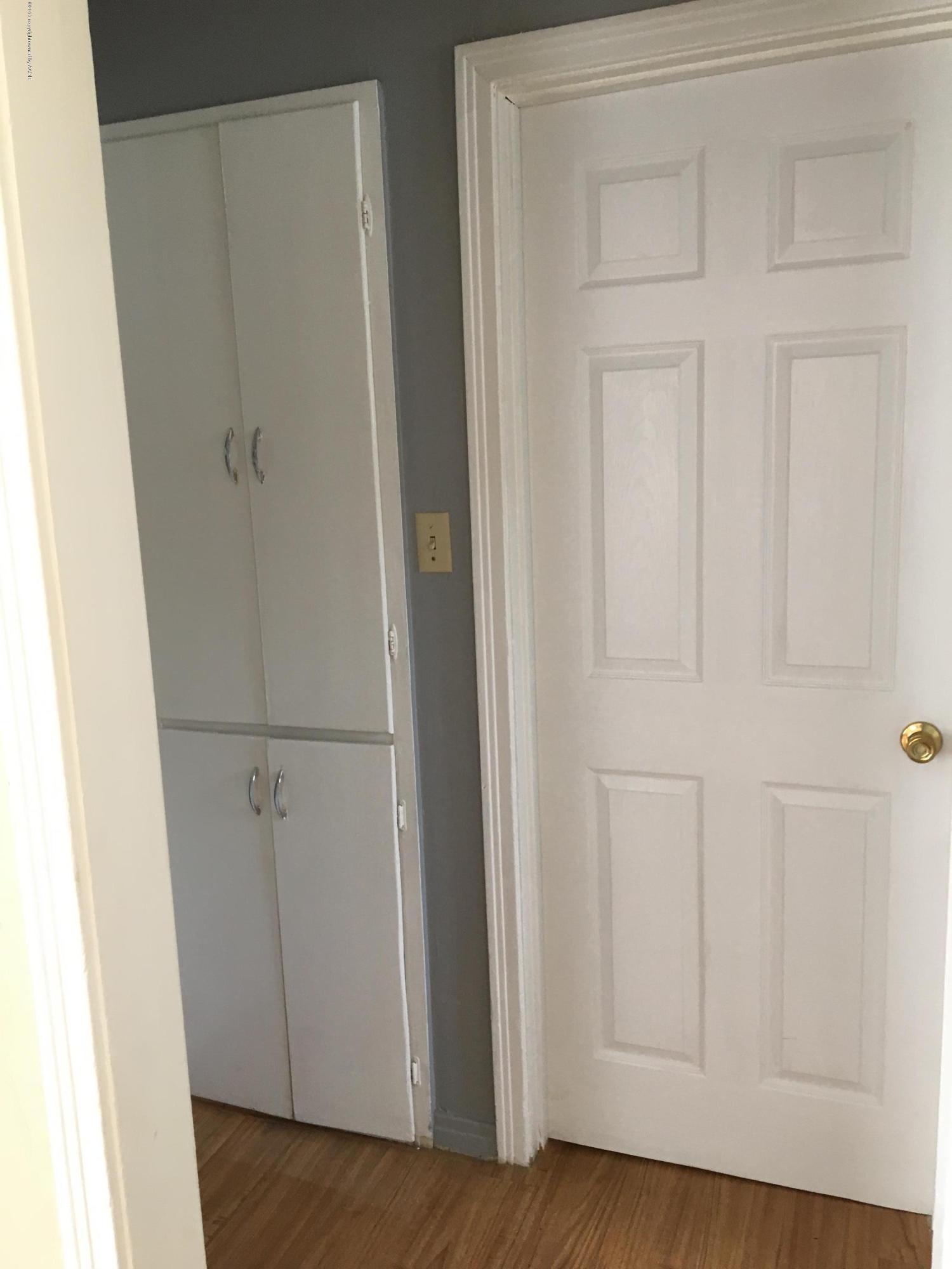 4128 South Polk Street Amarillo, TX 79110 - Photo 7 of 10 a view of a closet area with wooden floor