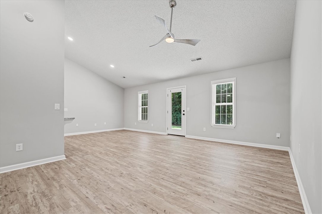 212 Blue Ridge Drive Clemson, SC 29631 - Photo 5 of 33 A spacious common area with vaulted ceilings and abundant natural light.
