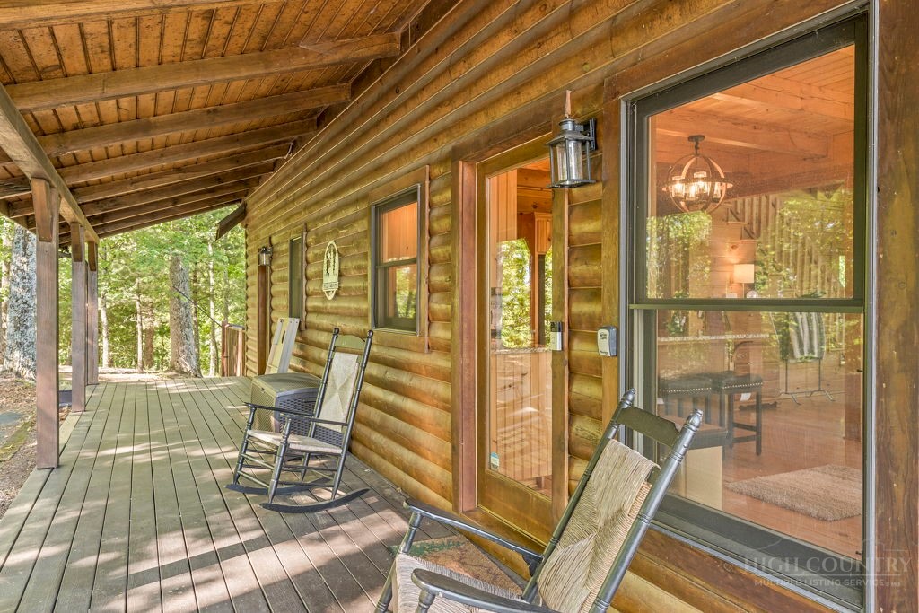2229 Elk Ridge Road Ferguson, NC 28624 - Photo 17 of 42 a view of a room with wooden floor and furniture
