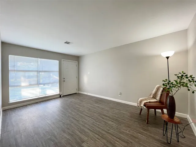 a room with furniture and wooden floor