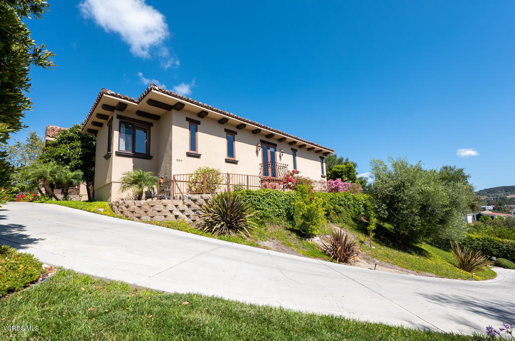 969 Rancho Road Thousand Oaks, CA 91362 - Photo 2 of 54 a front view of a house with a yard