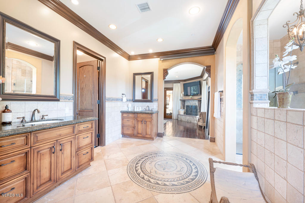 969 Rancho Road Thousand Oaks, CA 91362 - Photo 14 of 54 a bathroom with a sink a washer and dryer
