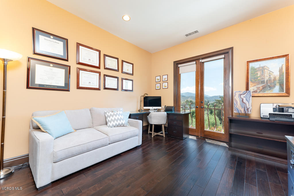 969 Rancho Road Thousand Oaks, CA 91362 - Photo 15 of 54 a living room with furniture and a flat screen tv with wooden floor