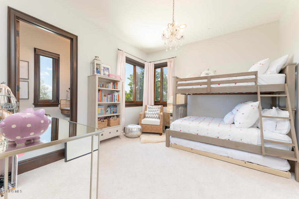 969 Rancho Road Thousand Oaks, CA 91362 - Photo 20 of 54 a bedroom with furniture and large windows