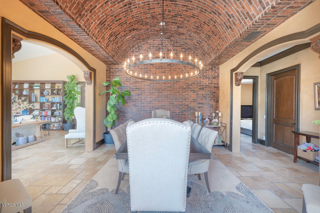 969 Rancho Road Thousand Oaks, CA 91362 - Photo 25 of 54 a dining room with furniture and a chandelier