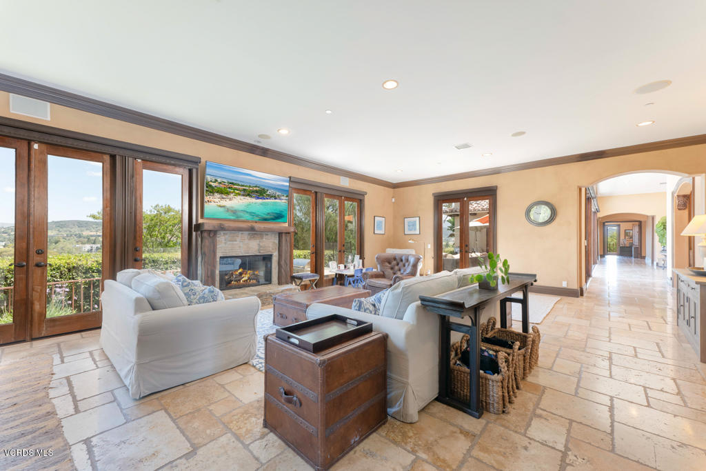 969 Rancho Road Thousand Oaks, CA 91362 - Photo 28 of 54 a living room with furniture and large windows