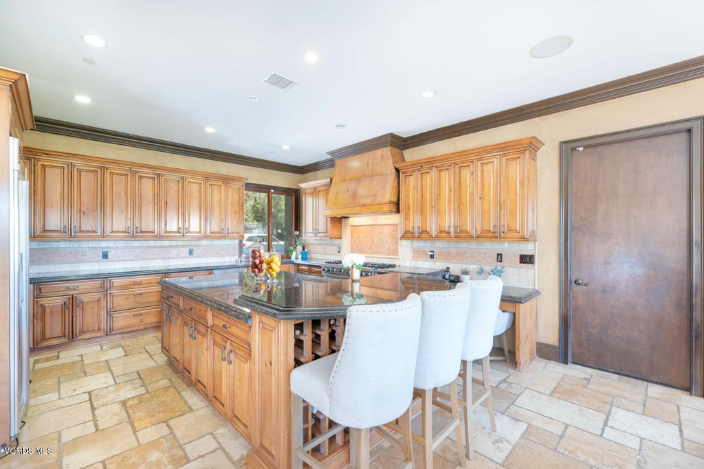 969 Rancho Road Thousand Oaks, CA 91362 - Photo 29 of 54 a kitchen with counter space appliances a sink and a large window