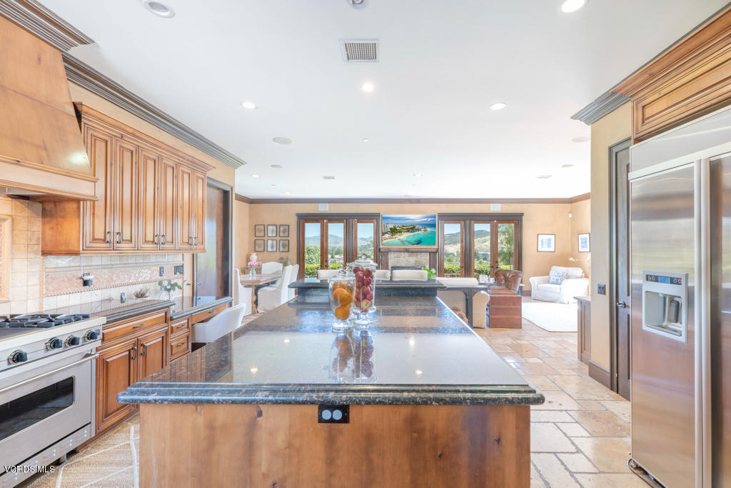 969 Rancho Road Thousand Oaks, CA 91362 - Photo 30 of 54 a kitchen with stainless steel appliances granite countertop a sink stove and refrigerator