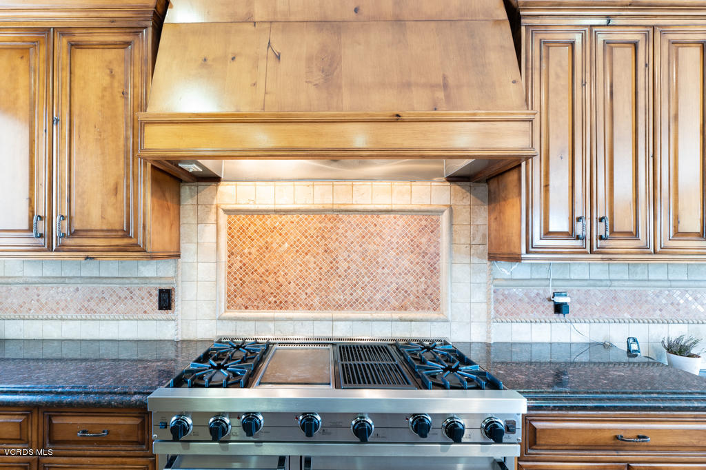 969 Rancho Road Thousand Oaks, CA 91362 - Photo 31 of 54 a kitchen with a stove and a window