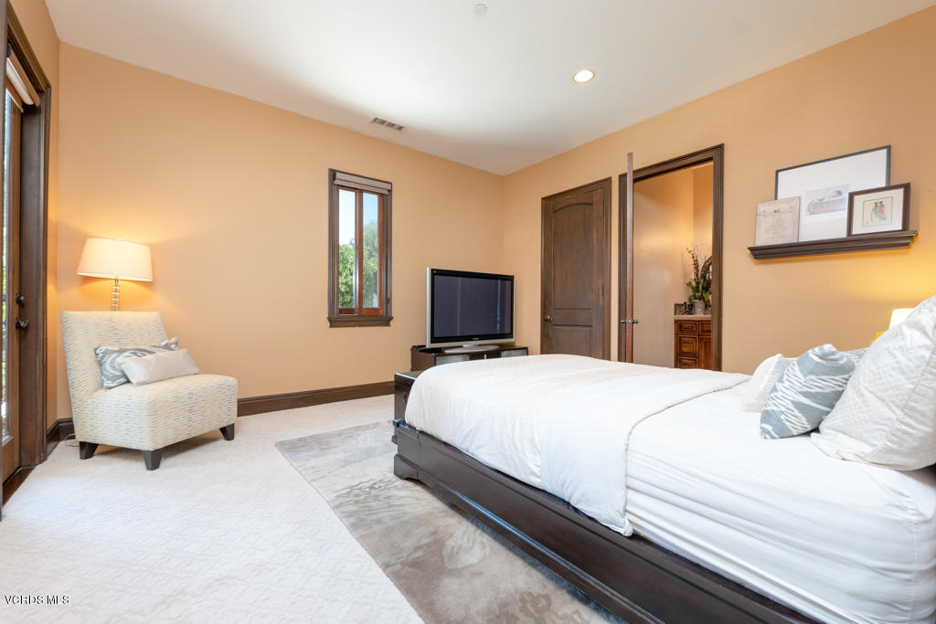 969 Rancho Road Thousand Oaks, CA 91362 - Photo 32 of 54 a bedroom with a bed and a couch